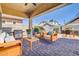Relax on the covered patio with outdoor kitchen and seating, perfect for entertaining at 4342 E Ronald St, Gilbert, AZ 85295