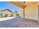 Spacious patio with brick pavers and view of the manicured backyard lawn at 4342 E Ronald St, Gilbert, AZ 85295