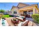 Beautiful backyard features a well manicured lawn, outdoor seating, and covered dining area at 4342 E Ronald St, Gilbert, AZ 85295