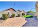 Paver patio, landscaped yard, and block fencing make this a desirable backyard at 4342 E Ronald St, Gilbert, AZ 85295