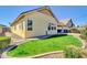 Exterior of the property featuring a well-maintained lawn, landscaping, and desert style hardscape at 4342 E Ronald St, Gilbert, AZ 85295