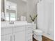 Bright bathroom featuring a single vanity, framed mirror, and shower with white curtain at 4342 E Ronald St, Gilbert, AZ 85295