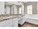 Spacious bathroom with granite countertops, soaking tub, and dual sinks at 4342 E Ronald St, Gilbert, AZ 85295