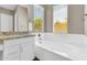 Well-lit bathroom with granite counters, soaking tub and dual windows with tree view at 4342 E Ronald St, Gilbert, AZ 85295