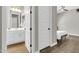Bedroom view through the bathroom featuring modern sink and lighting fixtures at 4342 E Ronald St, Gilbert, AZ 85295