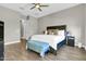 Relaxing bedroom with ceiling fan, soft lighting, neutral colors and king bed at 4342 E Ronald St, Gilbert, AZ 85295