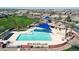 Overhead view of the community pool with shaded areas, palm trees, and neighborhood at 4342 E Ronald St, Gilbert, AZ 85295