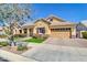 Single-story home with desert landscaping, a covered porch, and a spacious tandem 3-car garage at 4342 E Ronald St, Gilbert, AZ 85295