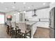 Open concept kitchen with island, granite counter, and seating for three at 4342 E Ronald St, Gilbert, AZ 85295