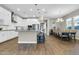 Spacious kitchen with white cabinets, large island, and a dining area at 4342 E Ronald St, Gilbert, AZ 85295