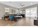 Bright living area with lots of natural light, wood-look tile floors, recessed lights, and a fan at 4342 E Ronald St, Gilbert, AZ 85295