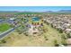 An aerial view showcases the community's extensive park system and amenities, nestled amidst well-maintained residential areas at 45539 W Long Way, Maricopa, AZ 85139