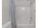Bathroom with a tiled shower and tub at 45539 W Long Way, Maricopa, AZ 85139