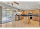 Modern kitchen boasts island, stainless appliances, and outdoor view at 45539 W Long Way, Maricopa, AZ 85139