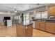 Well-appointed kitchen featuring granite countertops, stainless appliances, and island at 45539 W Long Way, Maricopa, AZ 85139