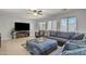Comfortable living room with plush seating and a ceiling fan for added comfort at 45539 W Long Way, Maricopa, AZ 85139