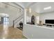 Bright and open living space with high ceilings, staircase, and tile flooring at 45539 W Long Way, Maricopa, AZ 85139