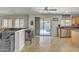 Open living space includes kitchen, living, and patio with outdoor seating at 45539 W Long Way, Maricopa, AZ 85139