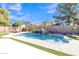 Backyard pool area with a slide and well maintained landscape at 45539 W Long Way, Maricopa, AZ 85139