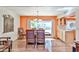 Dining room featuring stylish wooden furniture with a desert view and access to the kitchen at 4705 E Winston Dr, Phoenix, AZ 85044