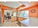 Dining room featuring tile countertops, light wood cabinets, and an open floor plan at 4705 E Winston Dr, Phoenix, AZ 85044