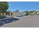 Street view of multiple homes with stucco and tile details, attached garages, and desert landscaping at 4705 E Winston Dr, Phoenix, AZ 85044