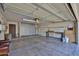 Spacious garage with ample storage space, workbench, and well-organized shelving at 4705 E Winston Dr, Phoenix, AZ 85044