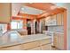 Spacious kitchen featuring modern appliances, tile countertops, and a sunlit ambiance at 4705 E Winston Dr, Phoenix, AZ 85044