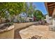 Backyard patio features stone pavers, desert landscaping, and an outdoor dining area at 4705 E Winston Dr, Phoenix, AZ 85044