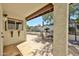 Outdoor patio area with stone pavers, a built-in bar and a table for entertaining at 4705 E Winston Dr, Phoenix, AZ 85044