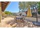 Beautiful patio with stone pavers, desert plants, and shaded seating area for outdoor enjoyment at 4705 E Winston Dr, Phoenix, AZ 85044