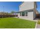 Backyard featuring artificial grass and covered patio, perfect for outdoor living at 4832 S Ferric --, Mesa, AZ 85212