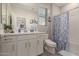 Nautical-themed bathroom features a white vanity and tub/shower combination at 4832 S Ferric --, Mesa, AZ 85212