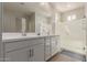Bathroom features double vanity, large mirrors, and a glass enclosed shower at 4832 S Ferric --, Mesa, AZ 85212