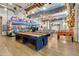 Community game room with shuffleboard, foosball, ping pong tables, and decorated classic vehicles at 4832 S Ferric --, Mesa, AZ 85212