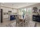 Bright and airy kitchen featuring a large island with seating, white cabinetry, and modern stainless steel appliances at 4832 S Ferric --, Mesa, AZ 85212