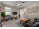 Cozy living room with TV, sofa, wood-topped coffee table, and neutral tones at 4832 S Ferric --, Mesa, AZ 85212