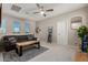 Living room with a sofa, a rug, and several windows for natural light at 4832 S Ferric --, Mesa, AZ 85212