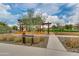Entrance to Selenium Park, featuring desert landscaping, a modern pergola, and a peaceful walking path at 4832 S Ferric --, Mesa, AZ 85212