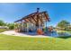 Open-air pavilion with modern design, featuring comfortable seating, trash cans, and beautiful green surroundings at 4832 S Ferric --, Mesa, AZ 85212