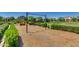Community playground area featuring a swingset and colorful play equipment, surrounded by lush landscaping at 4832 S Ferric --, Mesa, AZ 85212