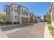 A row of modern two-story homes, each with private garages and well-kept landscaping, creating an inviting streetscape at 4832 S Ferric --, Mesa, AZ 85212