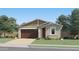 Charming single-story home features a two-car garage, landscaped yard, and neutral color scheme at 5027 S 233Rd Dr, Buckeye, AZ 85326