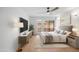 Staged bedroom featuring modern decor and ample natural light at 5211 N 24Th St # 104, Phoenix, AZ 85016