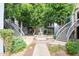 Beautiful courtyard featuring mature trees, a decorative fountain, and walkways to building access points at 5211 N 24Th St # 104, Phoenix, AZ 85016