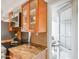 Modern kitchen featuring granite countertops, stainless steel appliances, and glass-front cabinets at 5211 N 24Th St # 104, Phoenix, AZ 85016