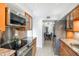 Modern kitchen featuring stainless steel appliances, granite countertops, and an open layout at 5211 N 24Th St # 104, Phoenix, AZ 85016