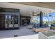 A stylish outdoor patio with comfortable seating, modern decor, and views of lush landscaping at 5211 N 24Th St # 104, Phoenix, AZ 85016