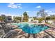 Outdoor pool with many chairs and building in background at 5211 N 24Th St # 104, Phoenix, AZ 85016