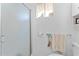 Clean, white bathroom with a glass-enclosed shower and decorative window at 5735 E Mcdowell Rd # 387, Mesa, AZ 85215